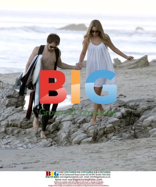 Lauren Conrad walks along beach