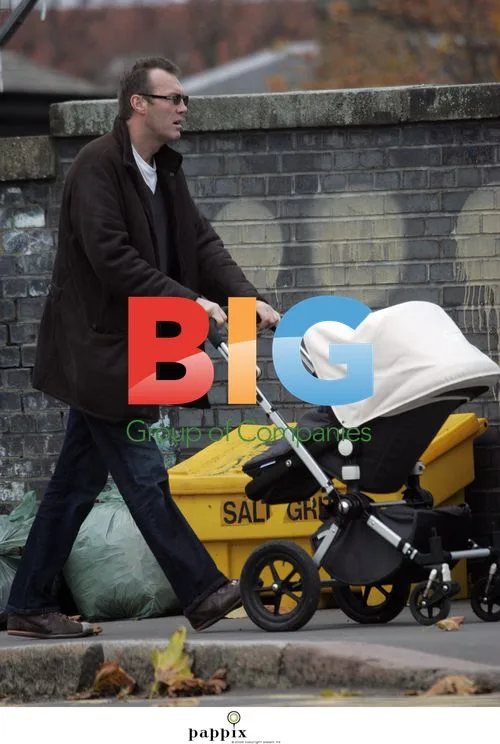 Andrew Morton takes baby for walk in London