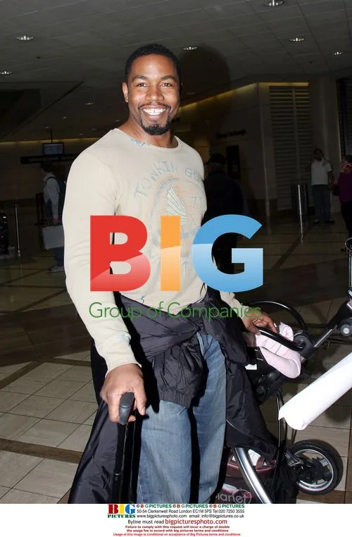 Michael Jai White arrives at LAX with family