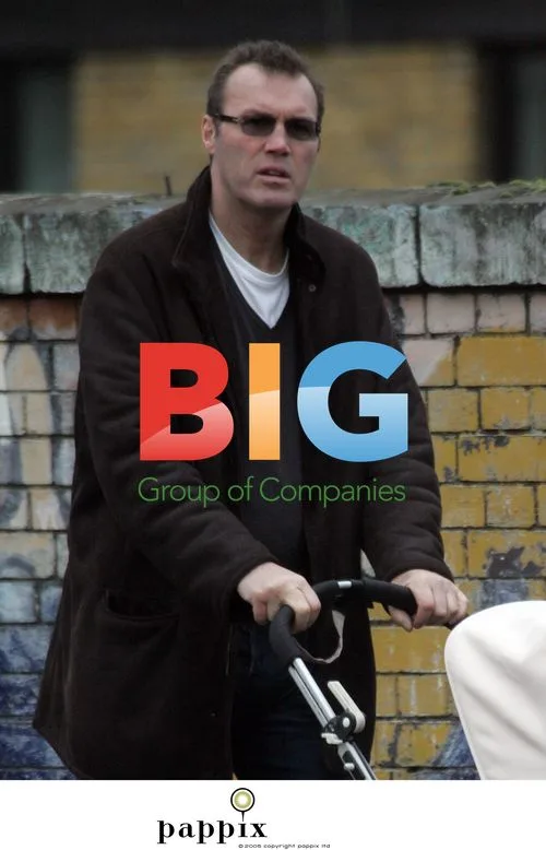 Andrew Morton takes baby for walk in London