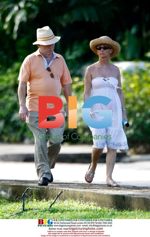 Paul Daniels and Debbie McGee strolling in Caribbean