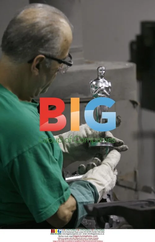 Luis Villalobos inspects Oscar statuette