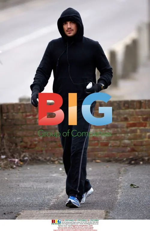 Peter Andre jogging in tracksuit