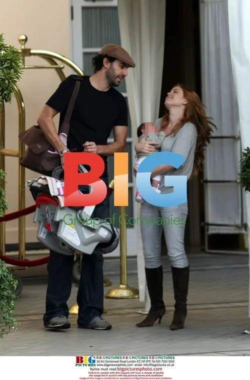 Sacha Baron Cohen and Isla Fisher with Baby Olive