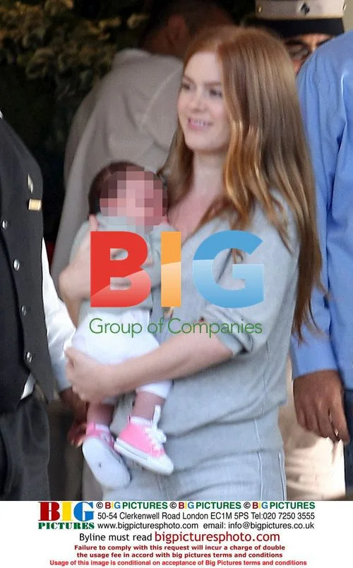 Sacha Baron Cohen and Isla Fisher with baby Olive