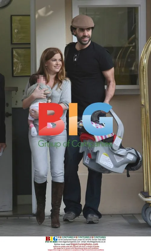 Sacha Baron Cohen and Isla Fisher with baby Olive