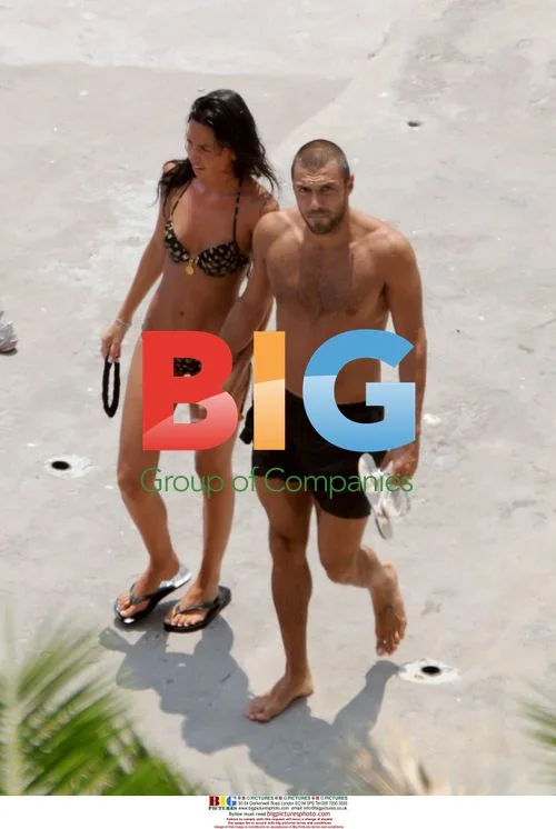 Andrew Dossena relaxes on beach in Capri
