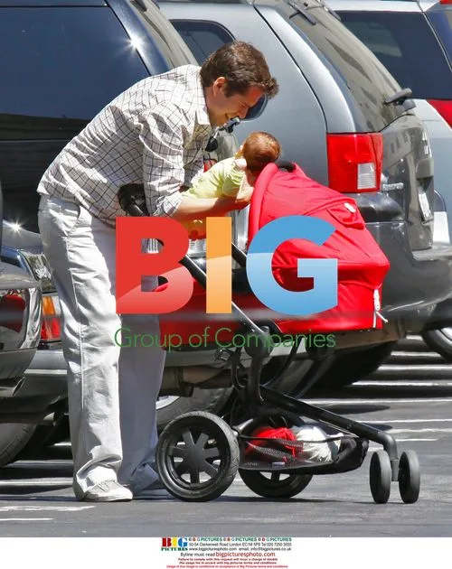 Alexis Denisof and Alyson Hannigan with baby