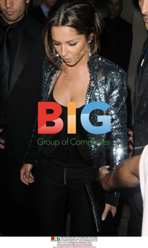 Cheryl leaving May Fair Hotel, London