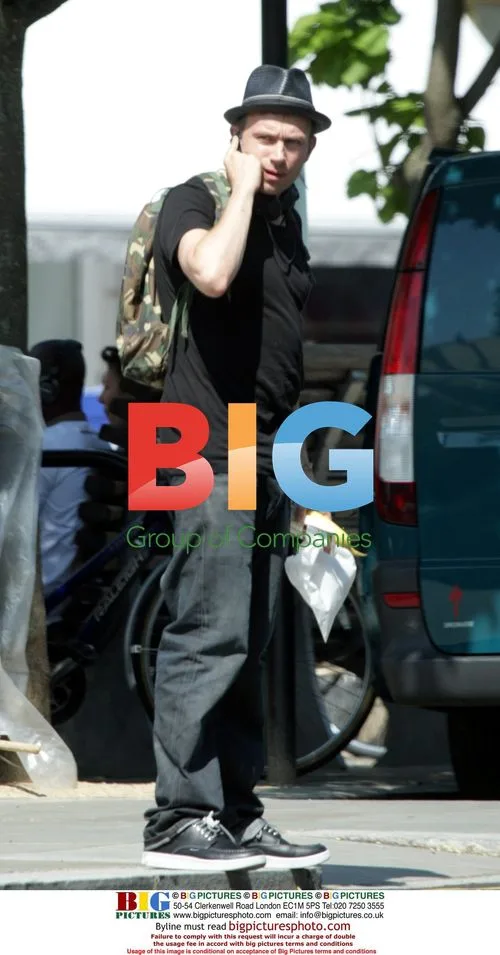 Damon Albarn eating banana in London