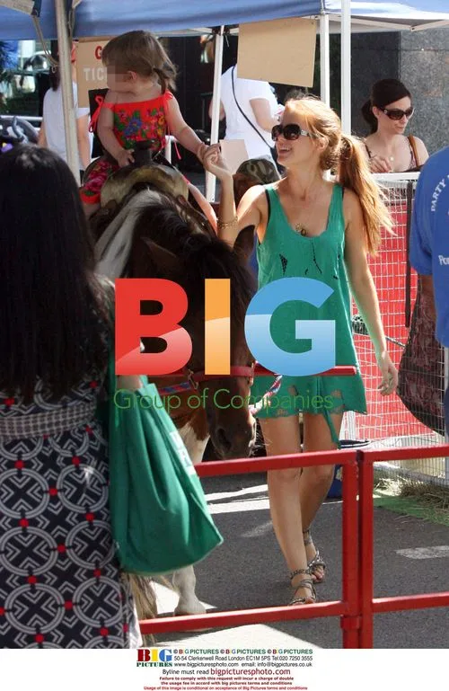 Isla Fisher and daughter at farmers market