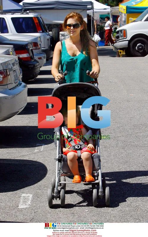 Isla Fisher and daughter at farmers market
