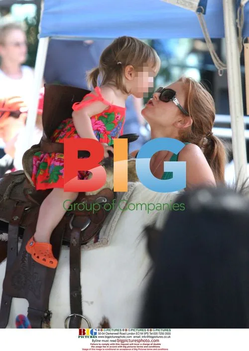 Isla Fisher and daughter at farmers market