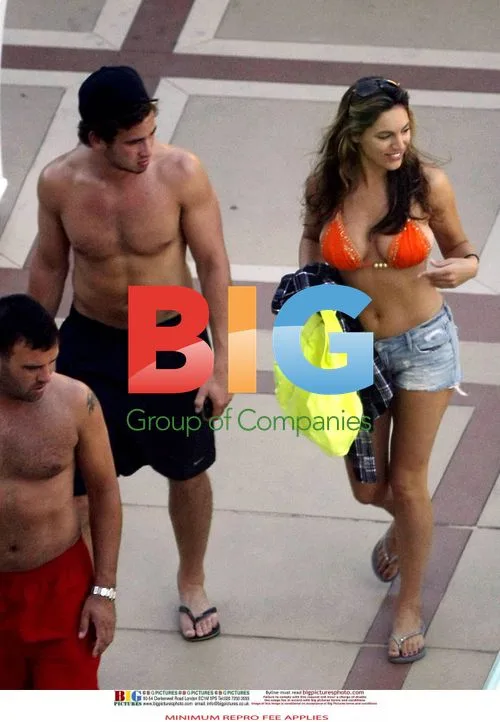 Kelly Brook and Danny Cipriani Poolside