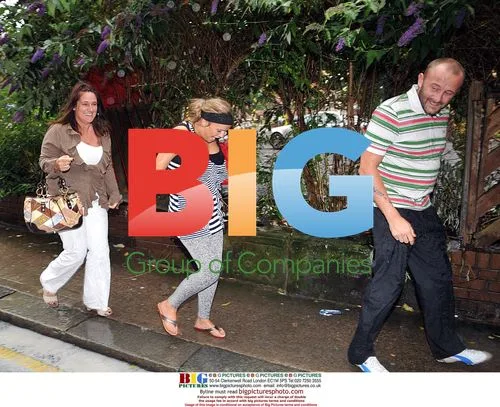 Kerry Katona and Mark Croft get soaked at the zoo