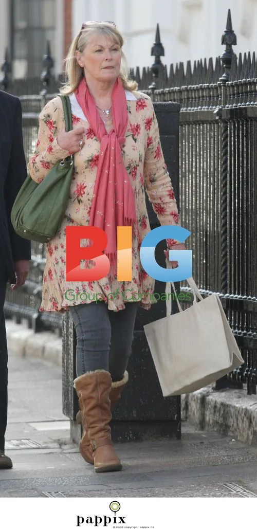 Sue Cook goes shopping with husband Ian in London
