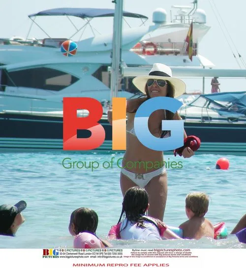 Elen Rives on beach with kids
