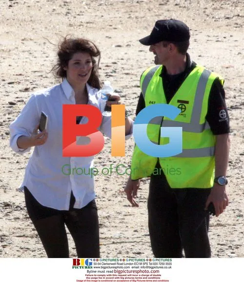 Gemma Arterton and cast on beach