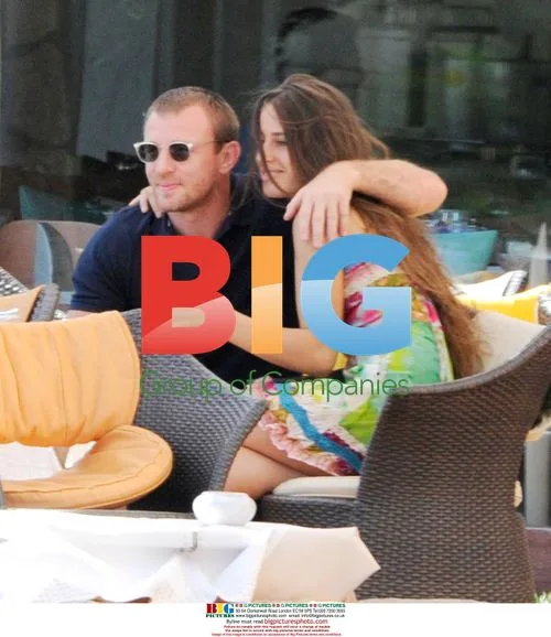 Guy Ritchie relaxes with twin sisters in Italy