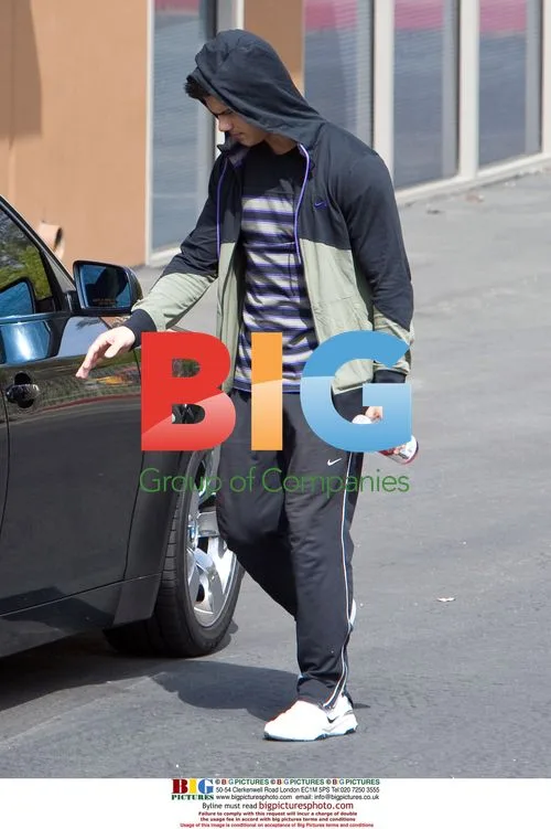 Taylor Lautner and father leaving gym