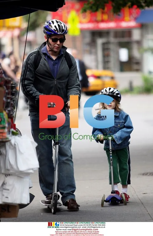 Matthew Broderick and son on scooters