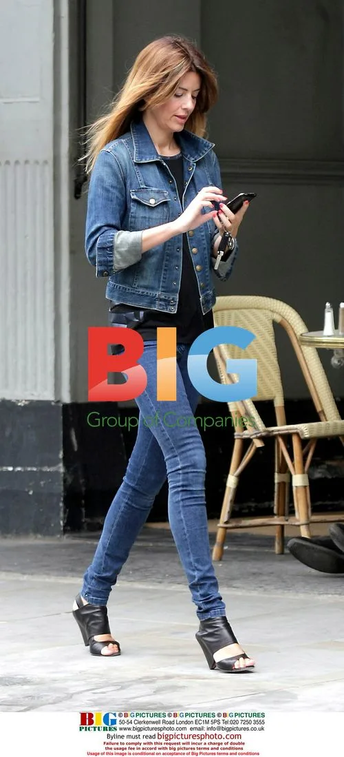 Sarah Mcdonald chats on her phone in London
