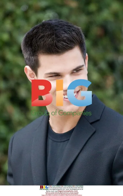 Taylor Lautner Poses for Photo Shoot