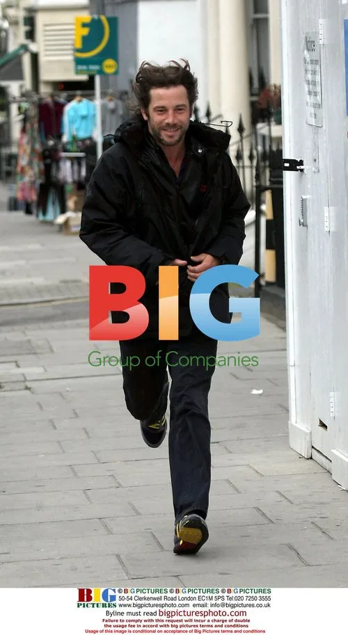 Jay Kay jogging with cigarette in London