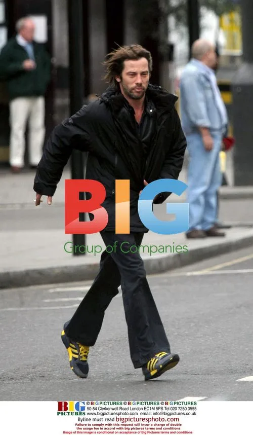Jay Kay jogging with cigarette in London