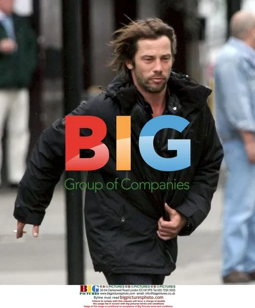 Jay Kay jogging with cigarette in London