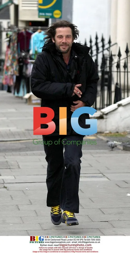 Jay Kay Hurries in Ladbrooke Grove with Cigarette
