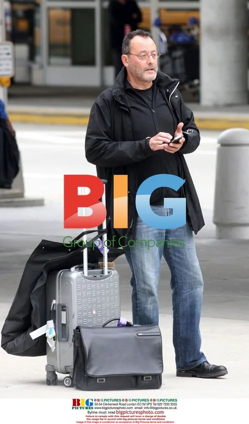 Jean Reno Spotted Texting at JFK