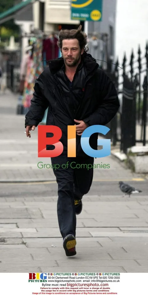 Jay Kay jogging with cigarette in London