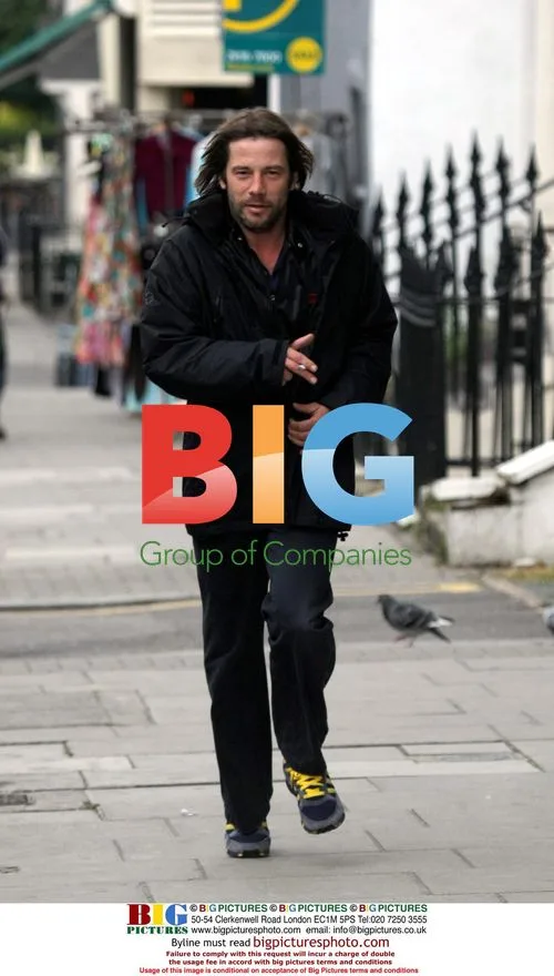 Jay Kay jogging with cigarette in London