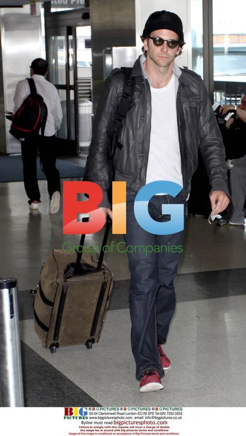 Bradley Cooper Takes Out Garbage at LAX