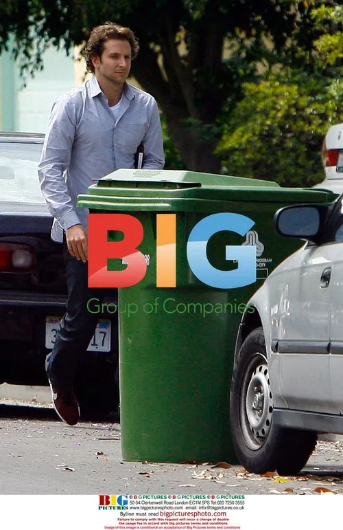 Bradley Cooper takes out trash at LAX
