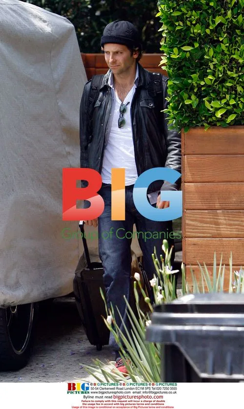 Bradley Cooper Takes Out Trash at LAX
