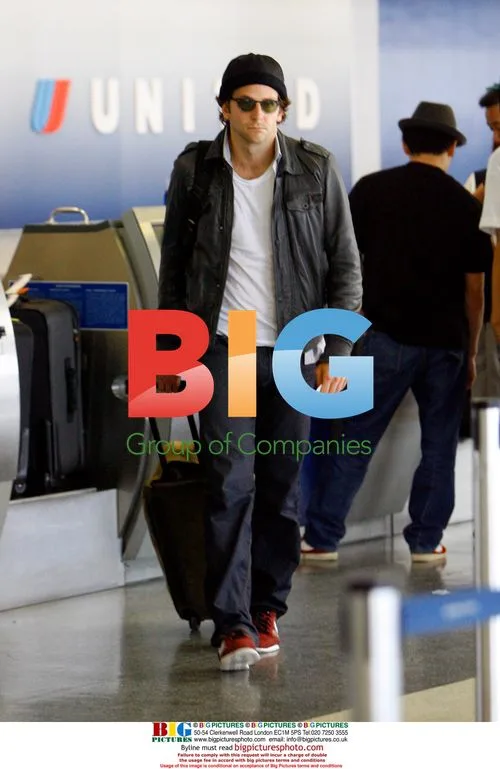 Bradley Cooper takes out trash at LAX
