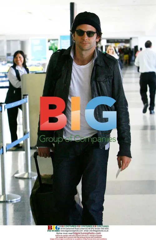 Bradley Cooper Takes Out Trash at LAX