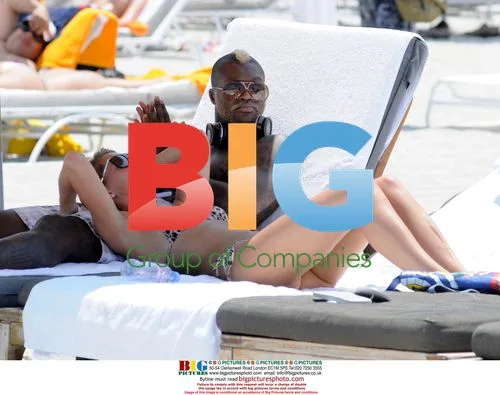 Djibril Cisse and wife on Miami beach