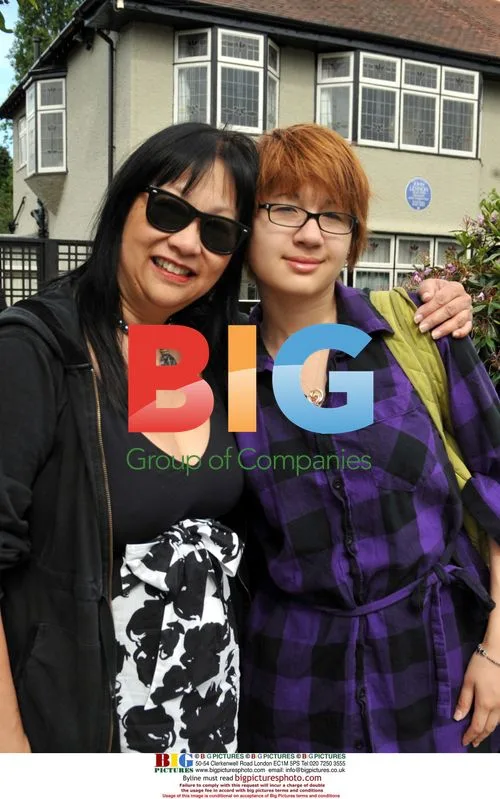 May Pang with daughter at Lennon's childhood home