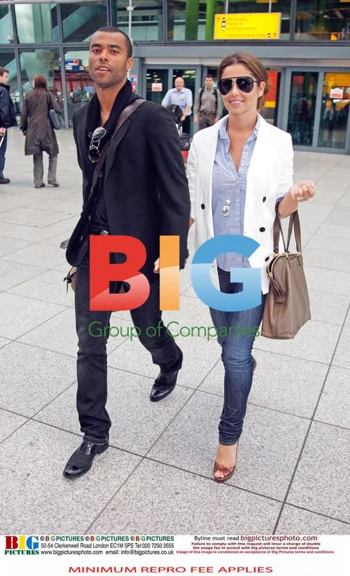 Ashley and Cheryl Cole return from France