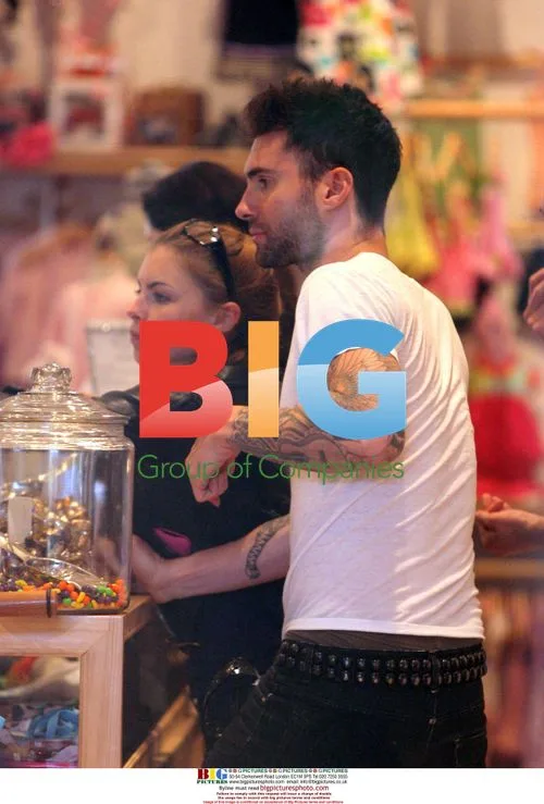 Adam Levine and girlfriend ride Harley