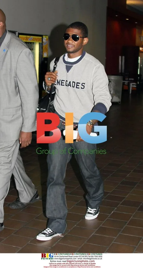Usher arrives at LaGuardia Airport