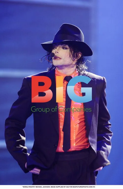 Michael Jackson in red shirt and black suit