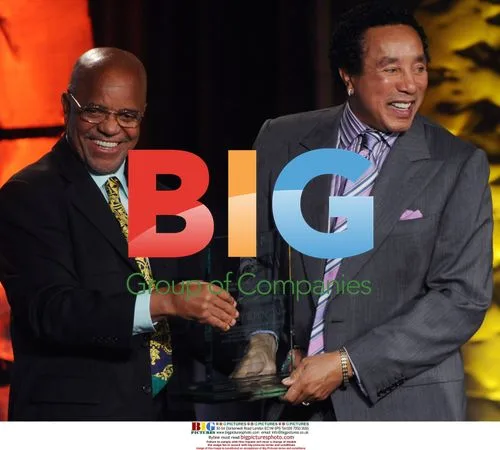 Berry Gordy presents Smokey Robinson with award