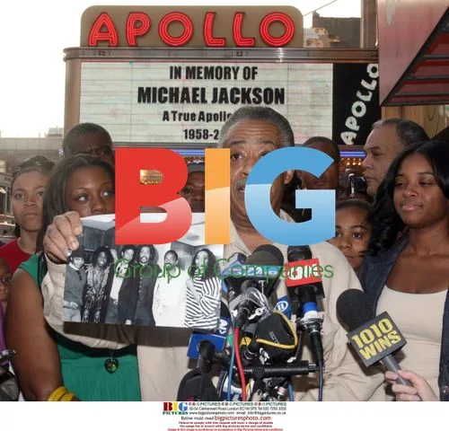 Rev Al Sharpton speaks outside Apollo