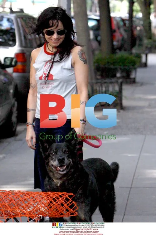 Janeane Garofalo and Dog Smile at Photographers