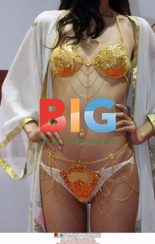 Model in gold bikini at wedding expo