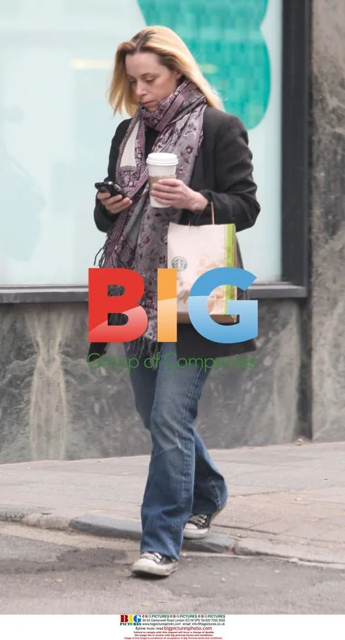Assistant producer Lauren Meek walks dog outside Ritchie's office